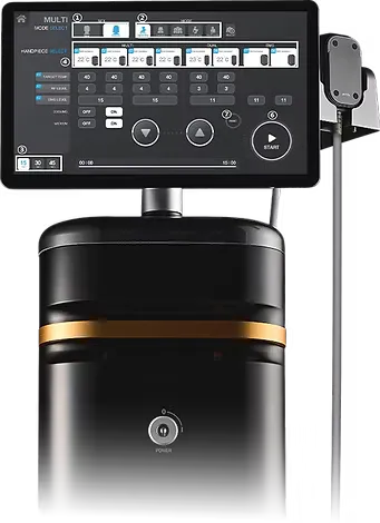 The MNML Tone console's operator panel showing mode select, per-handpiece target temperature, RF and EMS levels and the cooling and vacuum toggles, with an applicator on its hanger