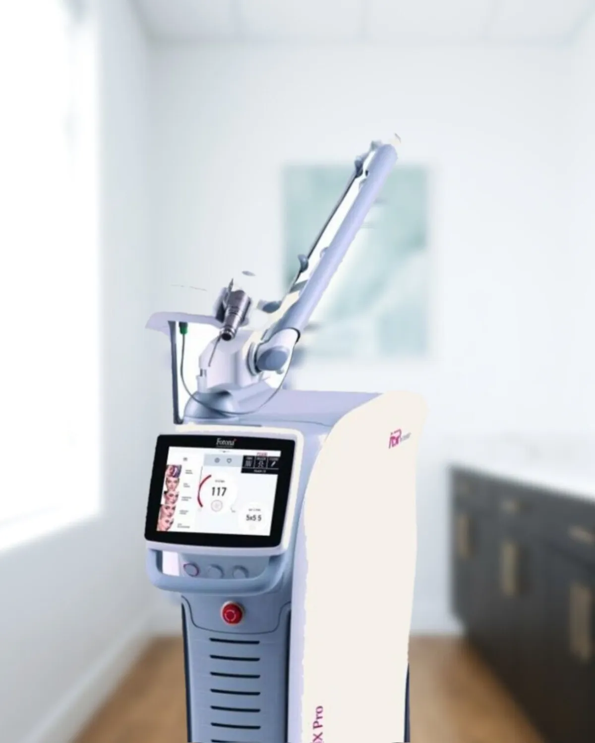 The practice's Fotona StarWalker MaQX Pro picosecond laser platform standing in a Medrein treatment room
