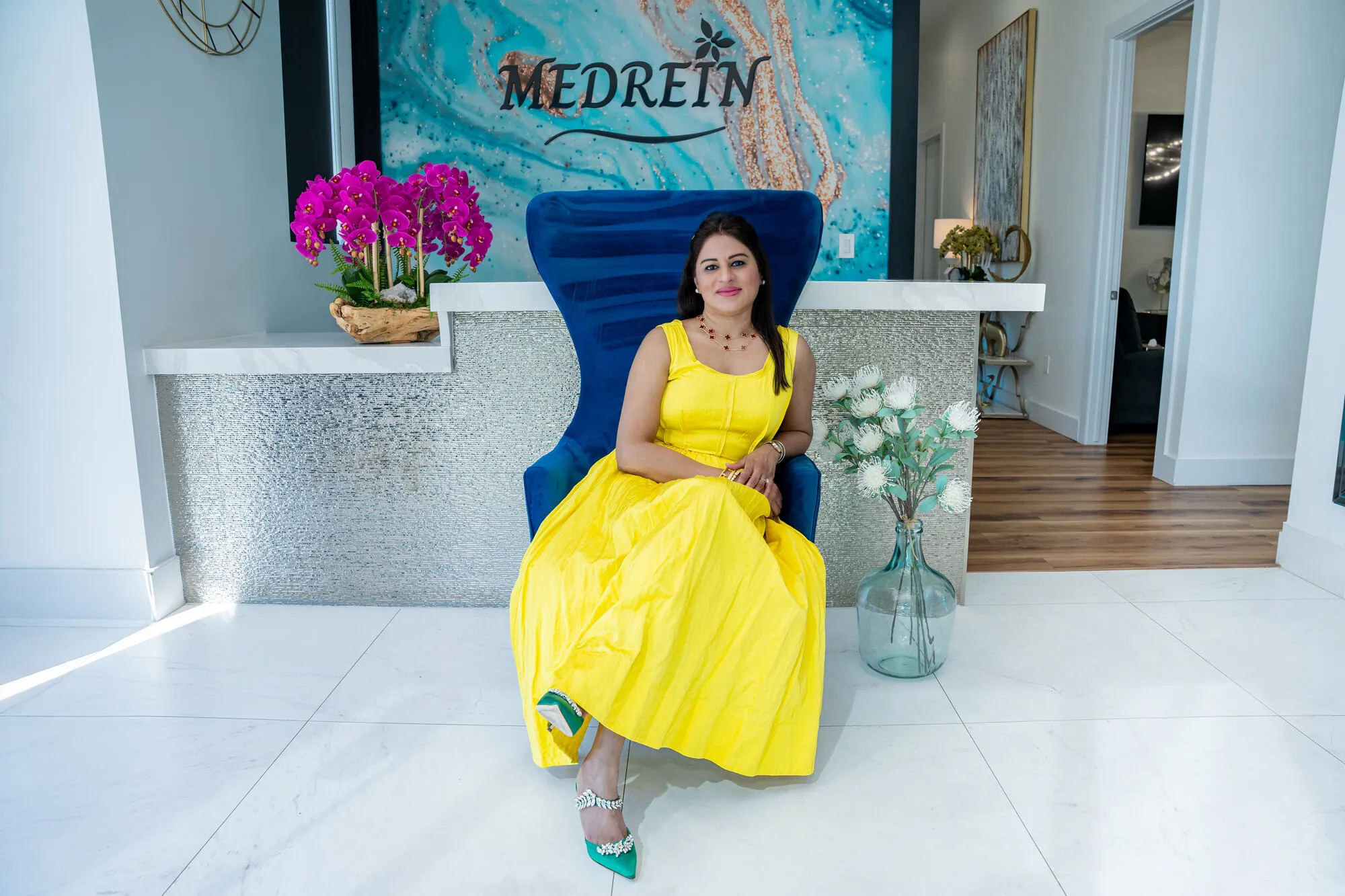 Dr. Haritha Mikkilineni, MD, seated at the Medrein Health clinic in Southlake, TX