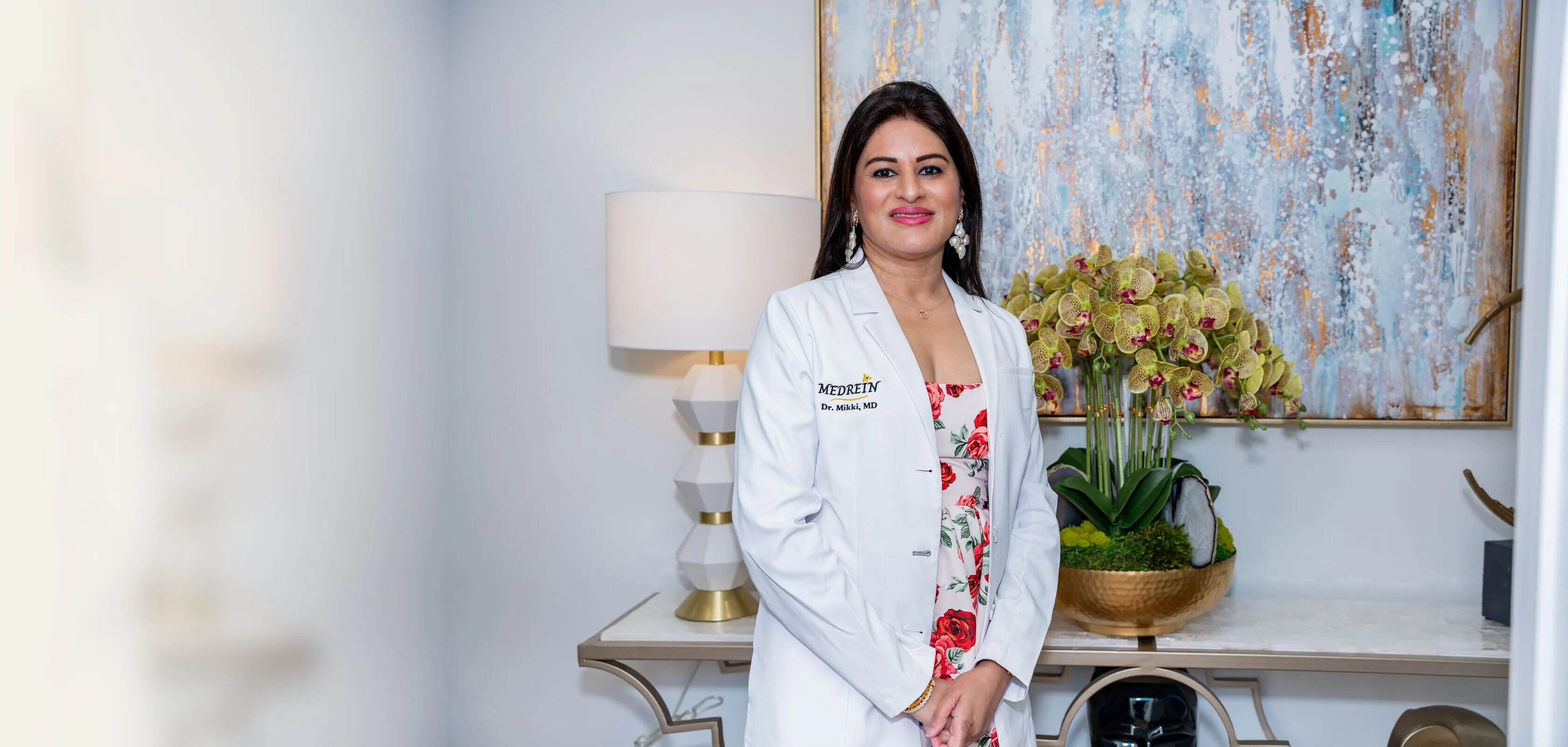 Dr. Mikki in her lab coat at Medrein Health & Aesthetics in Southlake, TX