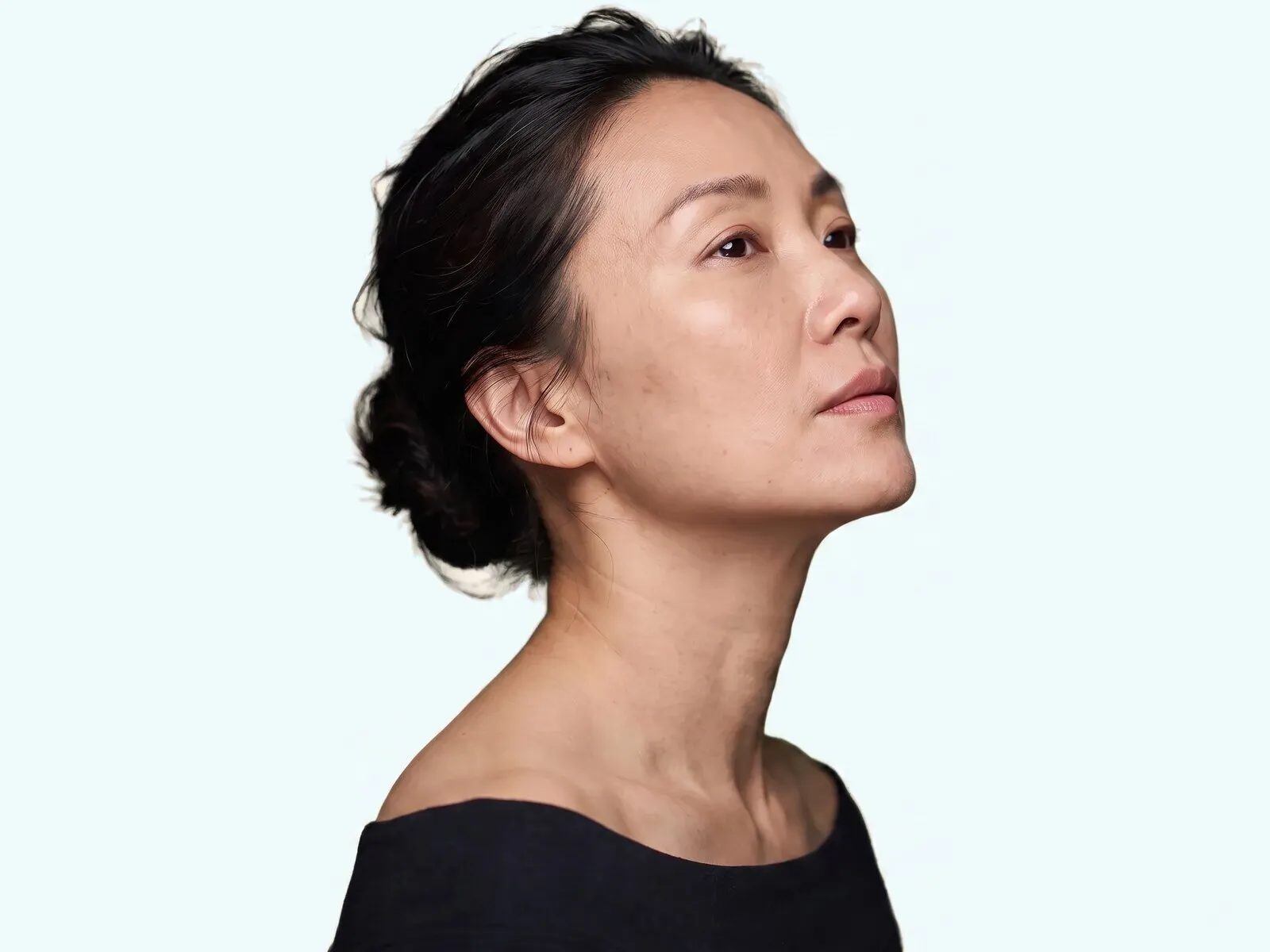 Jawline and neck of a woman in her forties with her chin lifted, the areas a 4D Facelift pass covers
