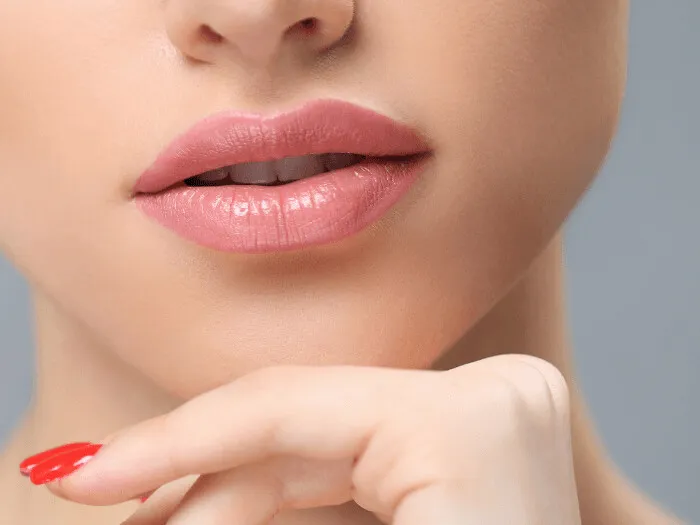Close view of full, softly defined lips and the skin above the lip line after laser collagen stimulation