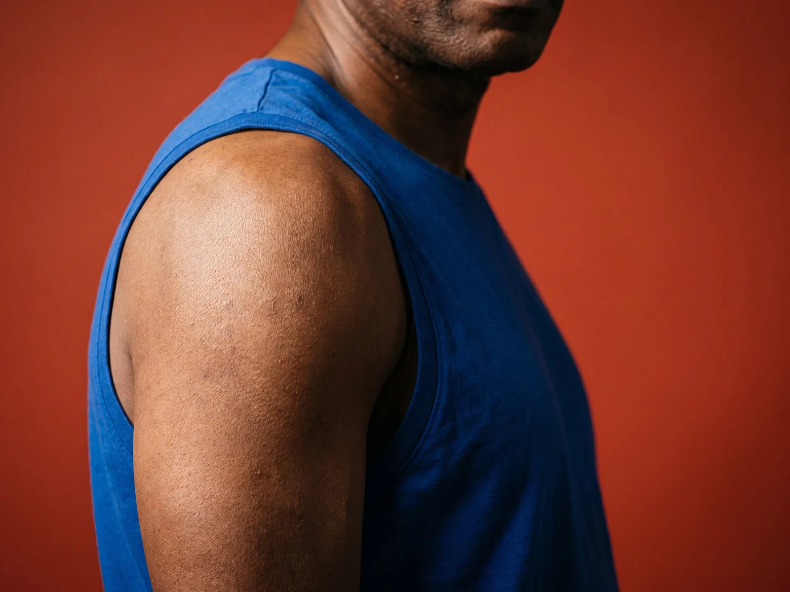 A man in his early fifties, shoulder and upper arm in frame, the muscle GHRH peptides act on