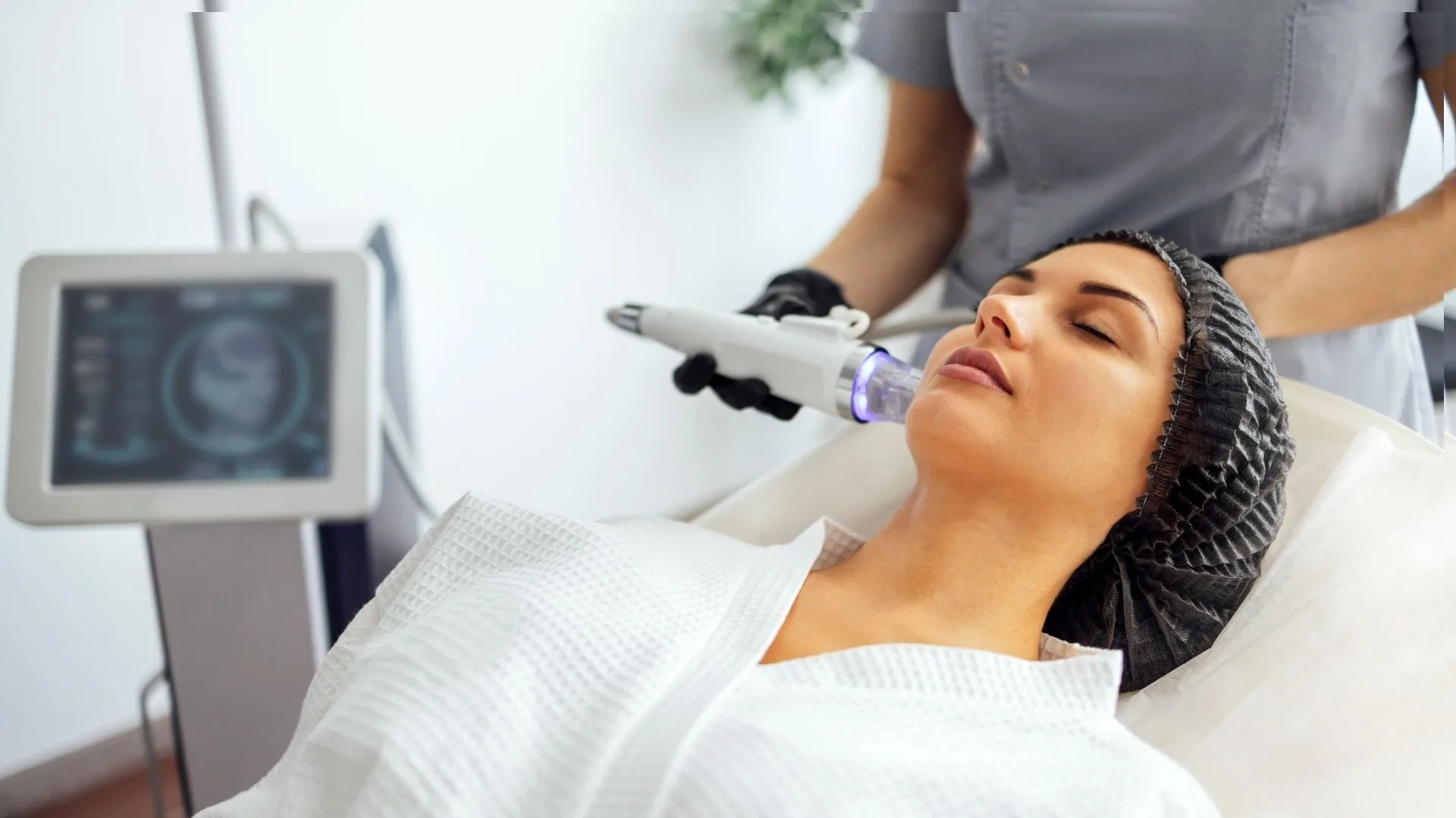 RF microneedling handpiece on the Lutronic Genius being applied to a patient's face at Medrein Health in Southlake, TX